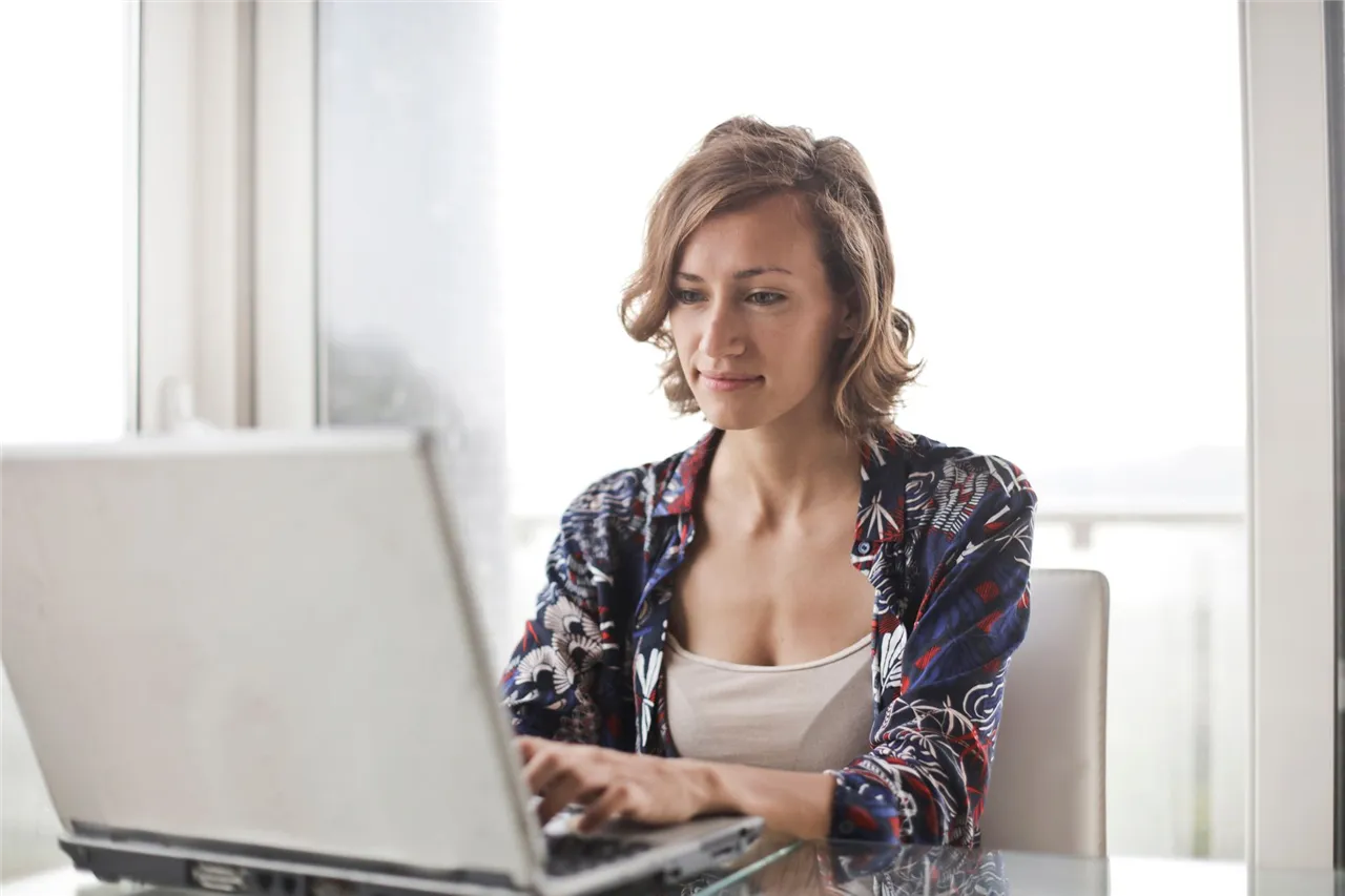Woman applying online to borrow money for bills in Canada