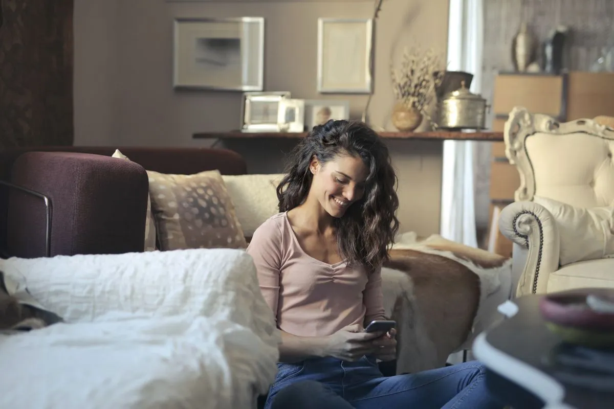 Woman browsing a borrow money app at home in Canada