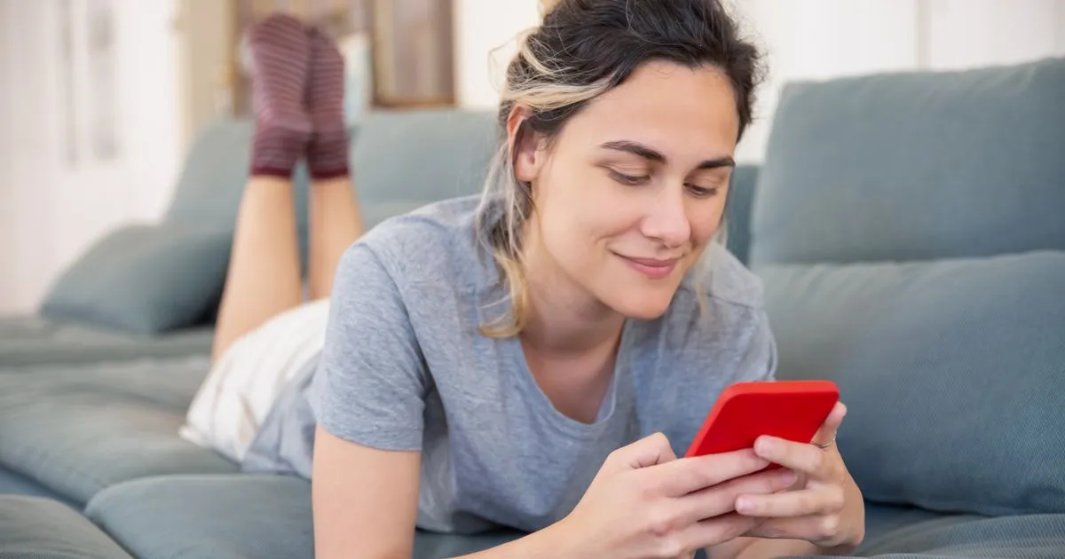 Woman using a borrow money app on her smartphone in Canada