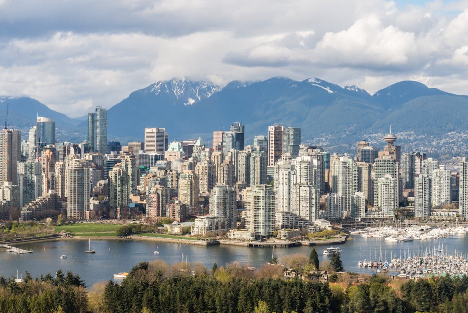 Vancouver skyline with mountains and marina in British Columbia, Canada