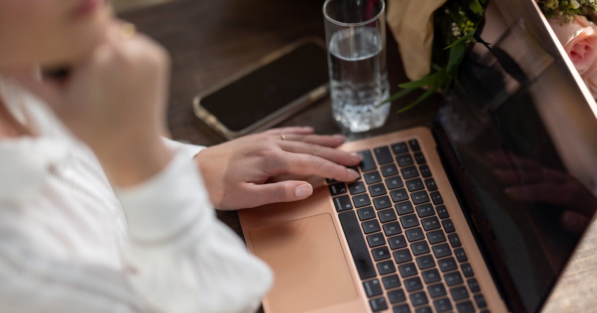 Researching answers about borrowing money online in Canada on a laptop