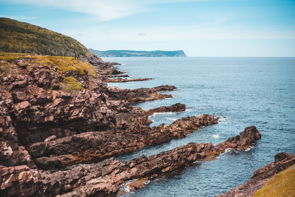 Cape Spear rugged cliffs meeting the Atlantic Ocean in Newfoundland, Canada