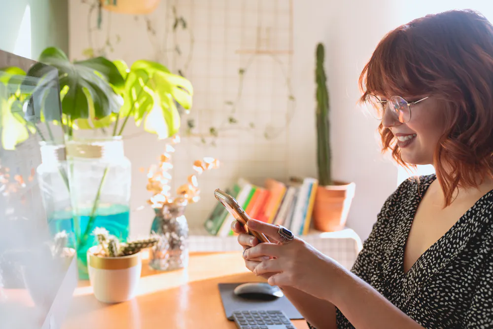 Woman in Toronto using her phone to apply to borrow money online