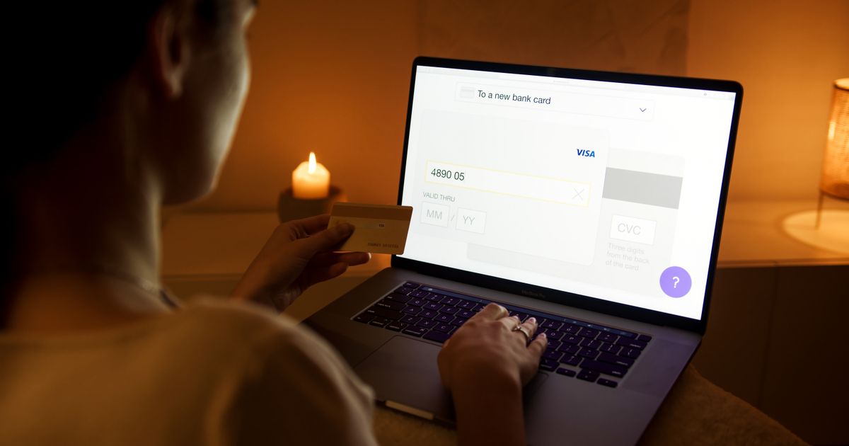 Person borrowing money online in Yukon, Canada via laptop