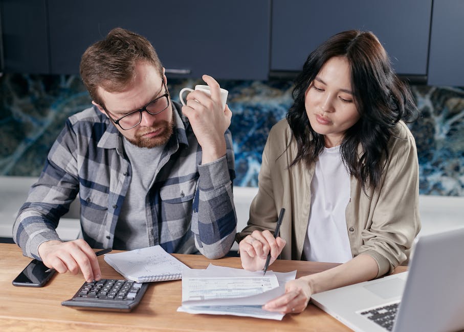 Couple reviewing loan amount options to borrow money online in British Columbia, Canada