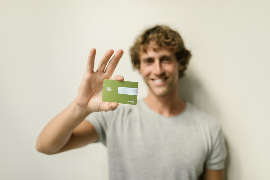 Man holding a credit card, one of the ways to borrow money online in Canada