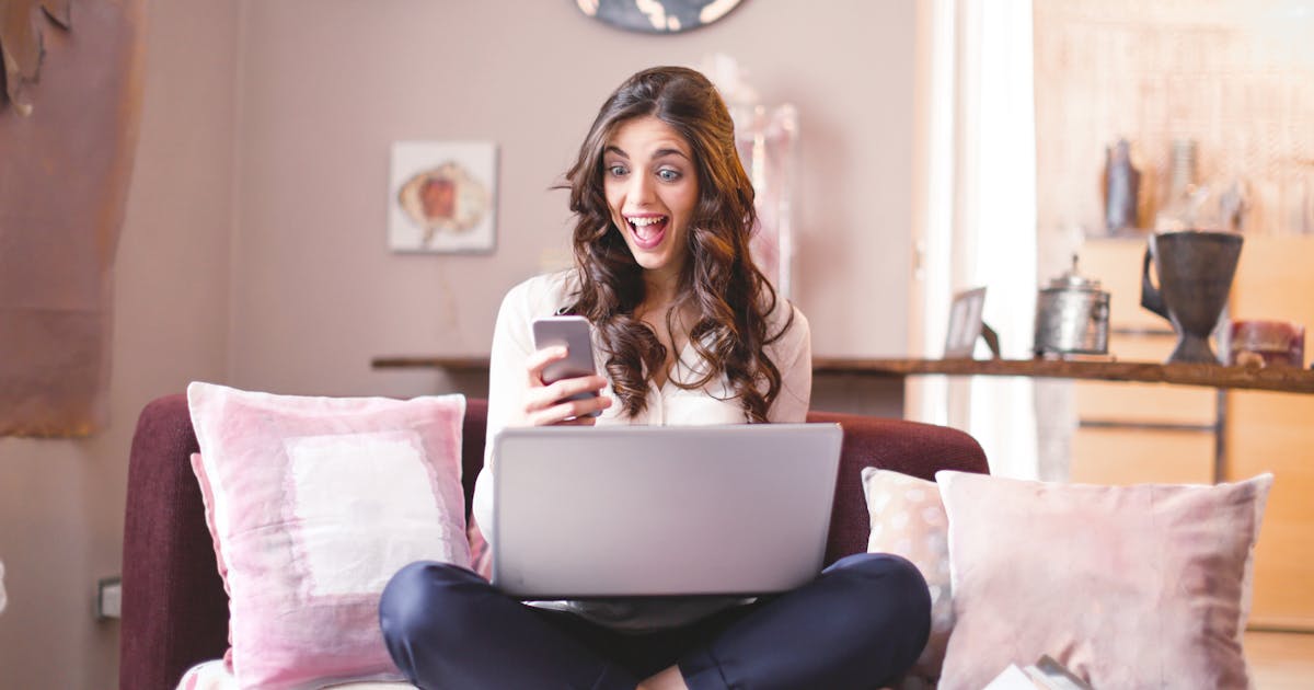 Excited woman starting an online loan application in Canada