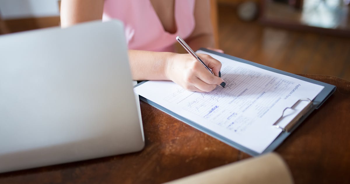 Woman filling out an online loan application in Canada