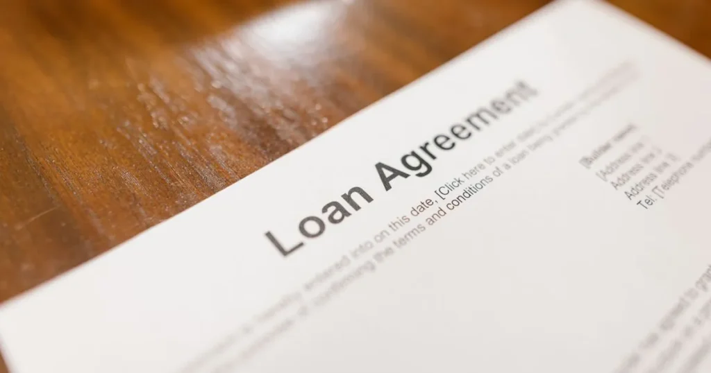 Loan agreement on a table - Canada's 35% interest rate cap protects borrowers