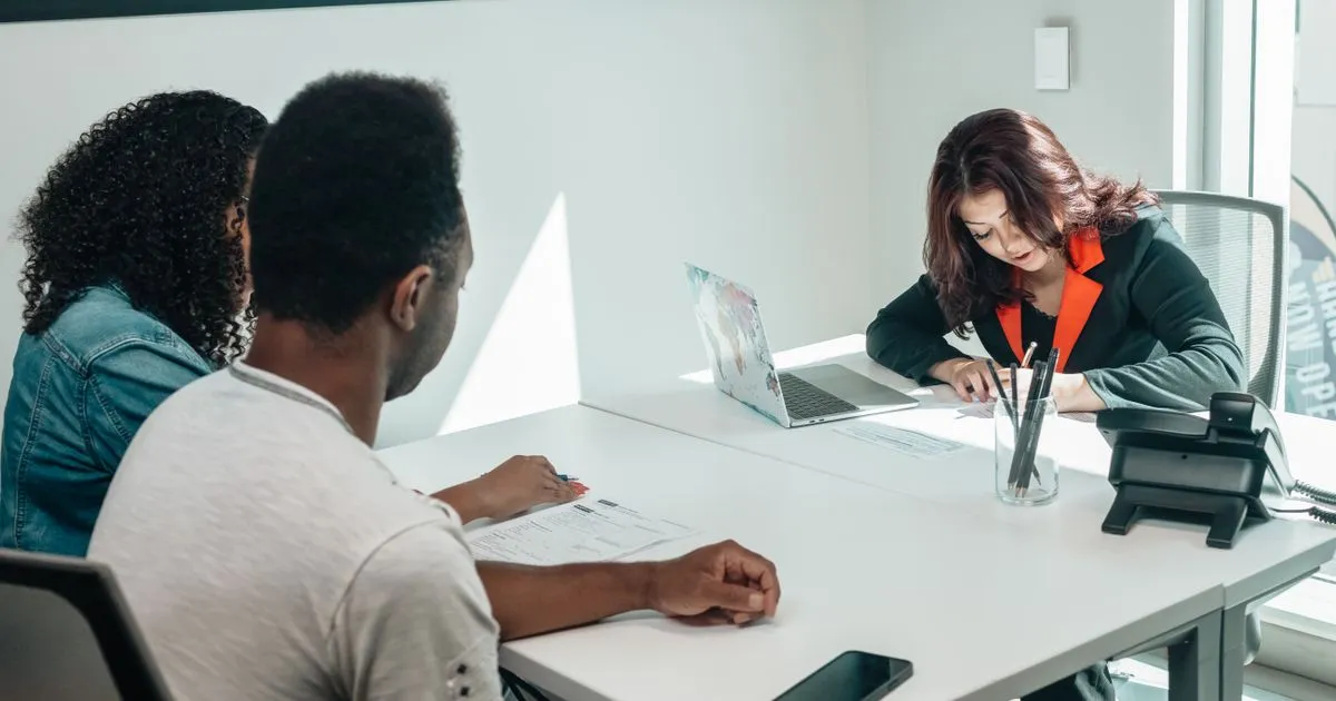 Couple meeting a bank advisor about a loan application