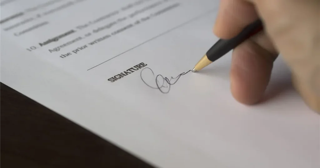 Signing a loan agreement after checking the cost of borrowing in Canada