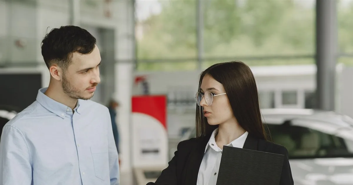 Customer discussing auto loan options at a dealership
