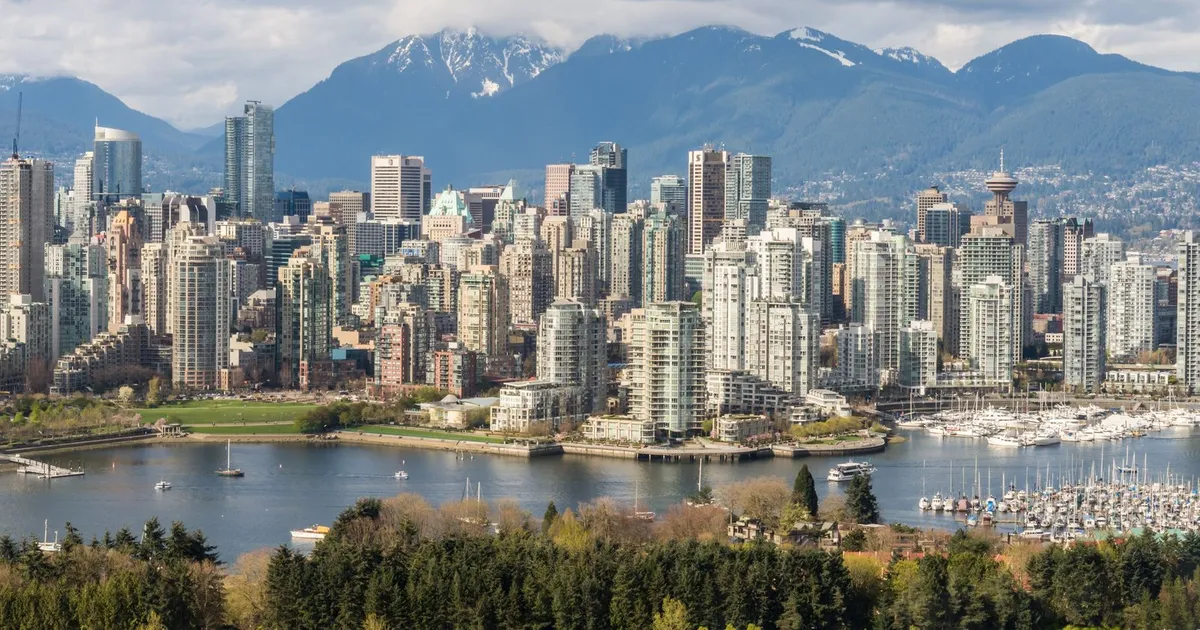 Vancouver skyline and harbour, where the window for money now closes three hours earlier than in Halifax